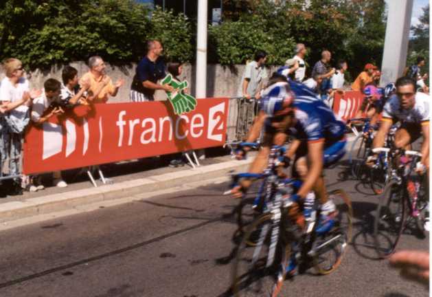 Head of peloton on final straight
